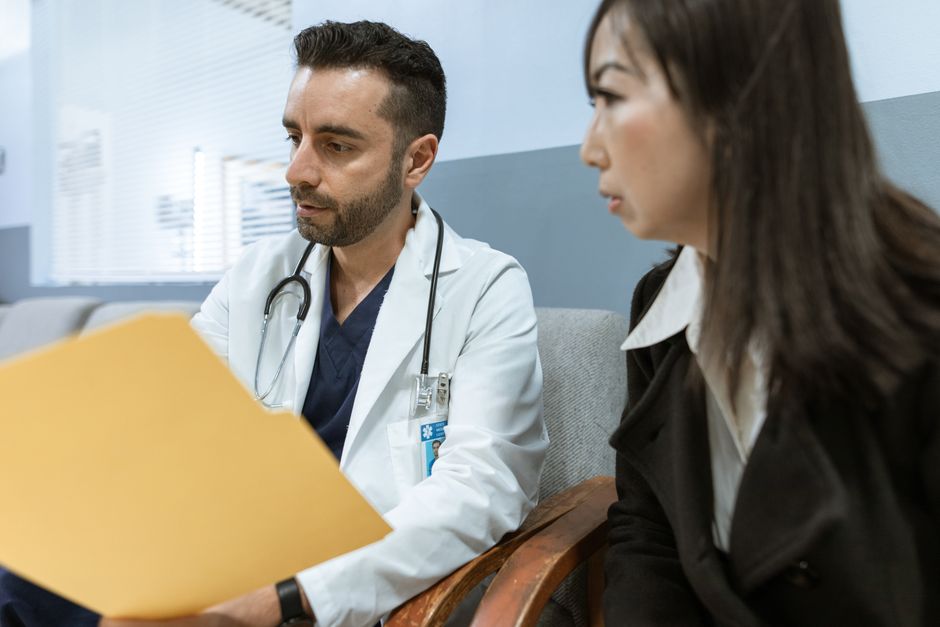 A doctor discussing records with a patient