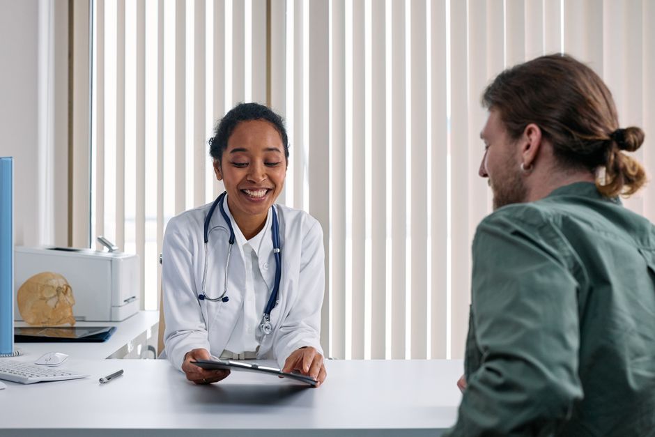 A clinician talking with a patient